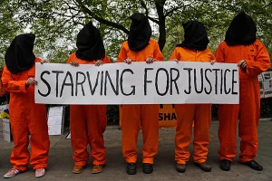 (photo via google images from: http://www.csmonitor.com/var/ezflow_site/storage/images/media/content/2013/07012/0701-hunger-striking-guantanamo-detainees/16248453-1-eng-US/0701-Hunger-striking-Guantanamo-detainees_full_600.jpg ) 